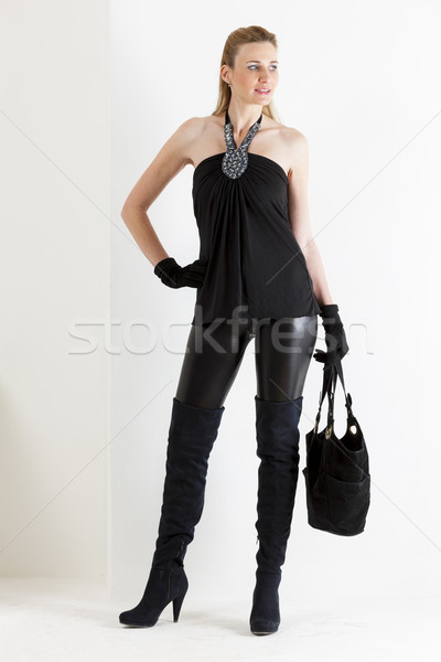 Stehen Frau tragen schwarz Kleidung Handtasche Stock foto © phbcz