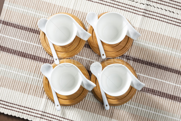 coffee cups on place mats Stock photo © phbcz