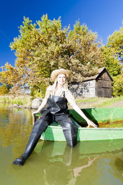 fisher woman sitting on boat Stock photo © phbcz
