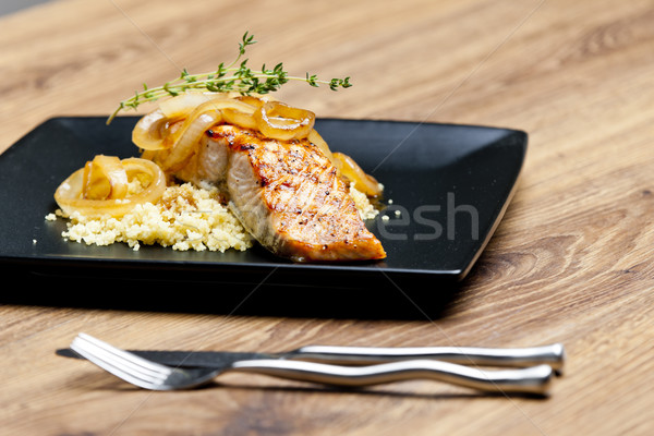 grilled salmon with burned onion and couscous Stock photo © phbcz