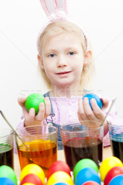 portrait of little girl during Easter eggs'' coloration Stock photo © phbcz