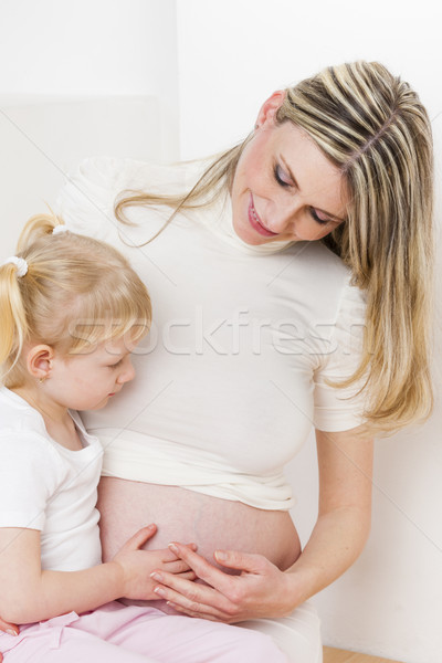 portrait of little girl with her pregnant mother Stock photo © phbcz