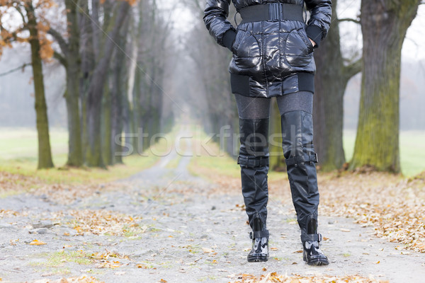 detail of woman wearing black clothes and boots in autumnal alle Stock photo © phbcz