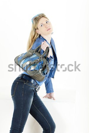 portrait of standing young woman wearing extravagant boots Stock photo © phbcz