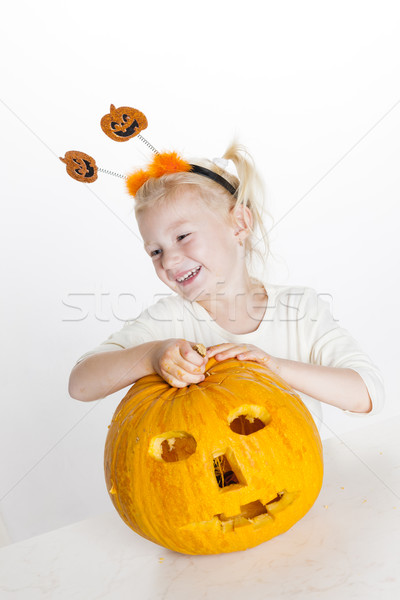 little girl carving pumpkin for Halloween Stock photo © phbcz