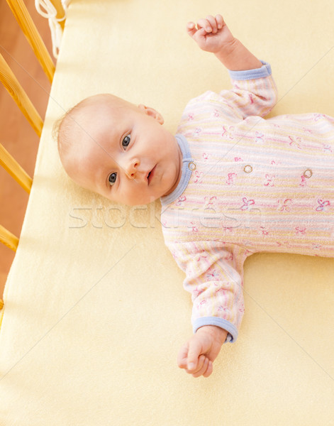 portrait of lying a two month old baby girl in cot Stock photo © phbcz