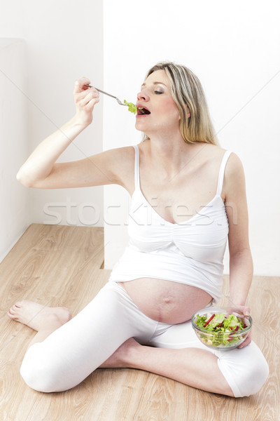 Stock photo: pregnant woman eating vegetable salad