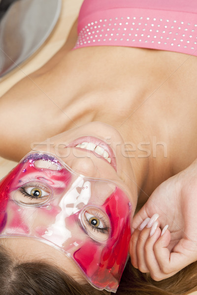 portrait of lying woman with cooling facial mask Stock photo © phbcz