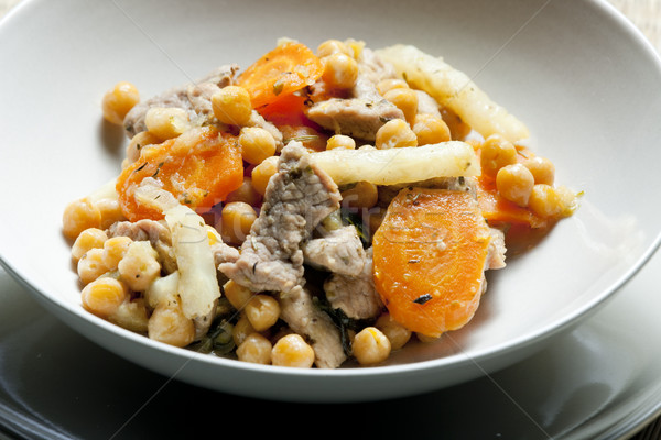 pork meat on celery with carrot and chick peas Stock photo © phbcz