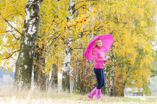 woman wearing rubber boots with umbrella in autumnal nature Stock photo © phbcz