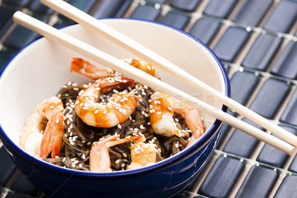 Japanese buckwheat noodles with prawns, soya sauce and sesame Stock photo © phbcz