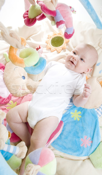 baby girl lying down on playing mat Stock photo © phbcz