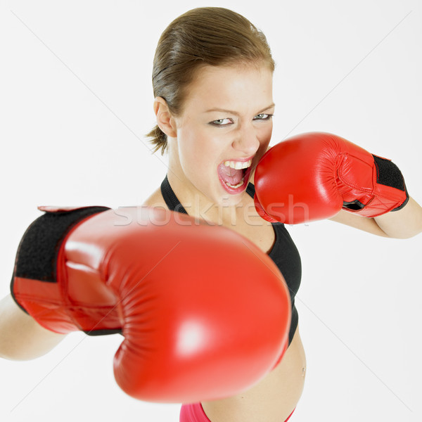 Kobieta rękawice bokserskie sportowe wykonywania młodych szkolenia Zdjęcia stock © phbcz
