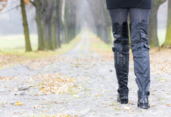 detail of woman wearing black clothes and boots in autumnal alle Stock photo © phbcz