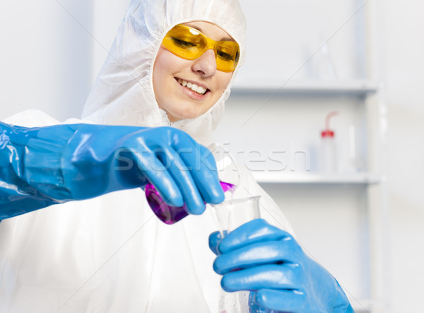 young woman wearing protective coat in laboratory Stock photo © phbcz