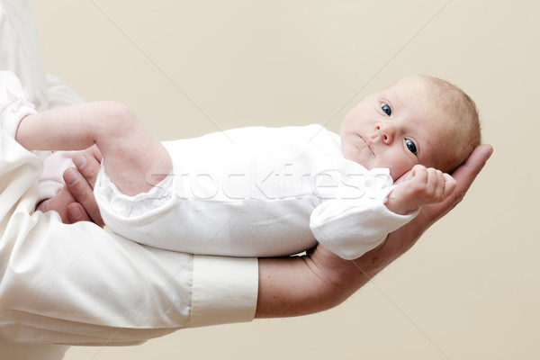 newborn baby girl lying on arm Stock photo © phbcz