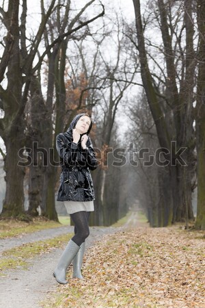 woman wearing black clothes and boots in autumnal alley Stock photo © phbcz