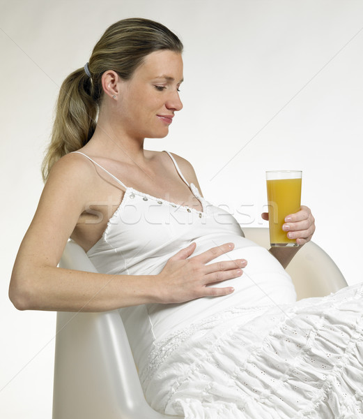 pregnat woman with a glass of juice Stock photo © phbcz