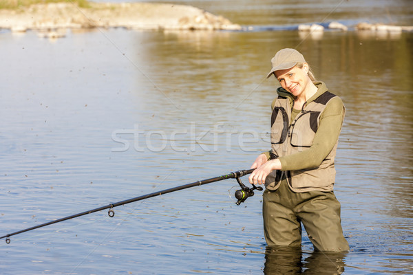 woman fishing in the river Stock photo © phbcz