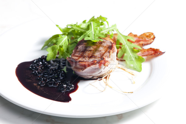 beefsteak grilled in bacon with sauce of juniper and red wine Stock photo © phbcz
