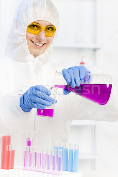 young woman wearing protective coat in laboratory Stock photo © phbcz