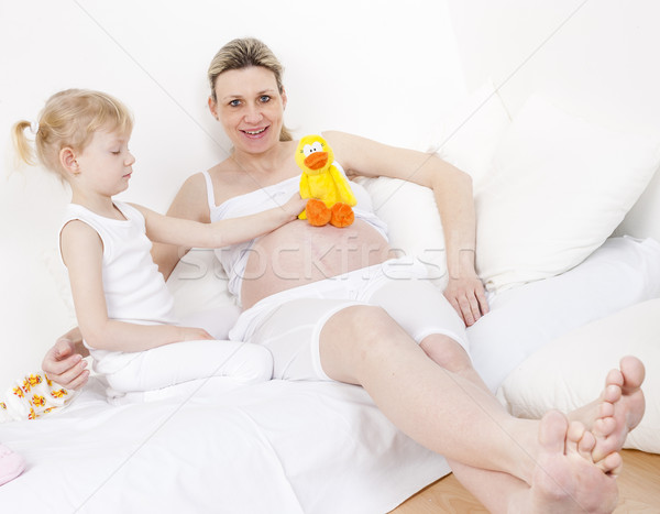 little girl and her pregnant mother with a toy for a baby Stock photo © phbcz