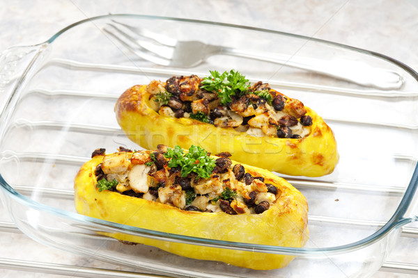 chicken meat with black beans baked in potatoes Stock photo © phbcz