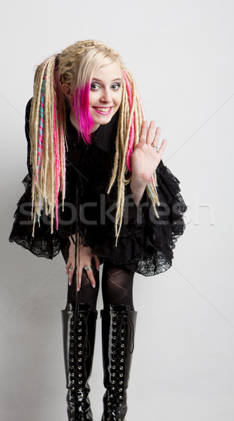 young woman with dreadlocks wearing extravagant clothes and boot Stock photo © phbcz