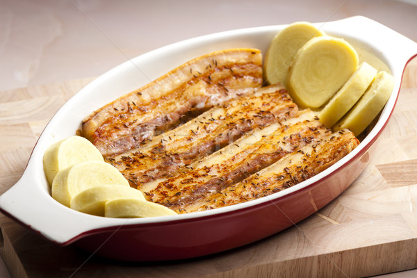 Sült disznóhús has kömény krumpli tányér Stock fotó © phbcz