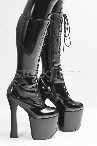 detail of standing woman wearing extravagant boots Stock photo © phbcz