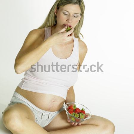 pregnat woman with strawberries Stock photo © phbcz