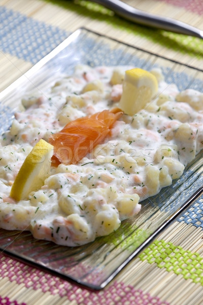 Stock photo: potato halusky (dumplings) with smoked salmon (Slovakian cuisine