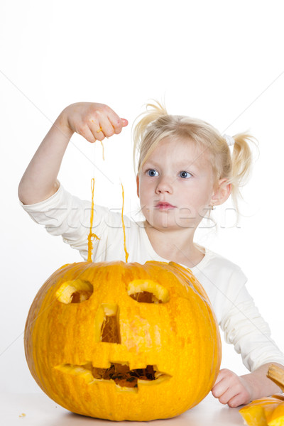 little girl carving pumpkin for Halloween Stock photo © phbcz