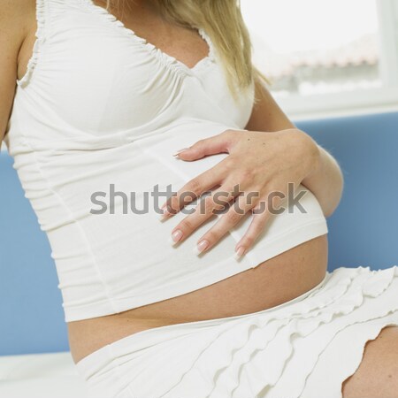 pregnat woman with shoes for babies Stock photo © phbcz