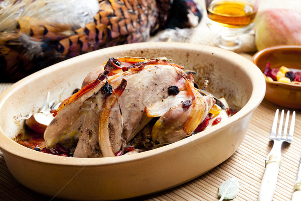 Stock photo: baked pheasant with bacon, pear, raisins on brandy