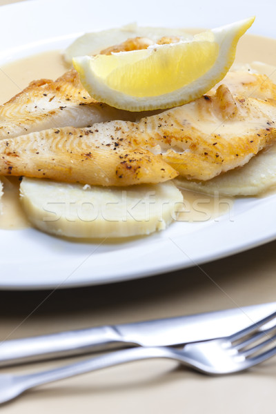 fried halibut with sweet potatoes and lemon sauce Stock photo © phbcz
