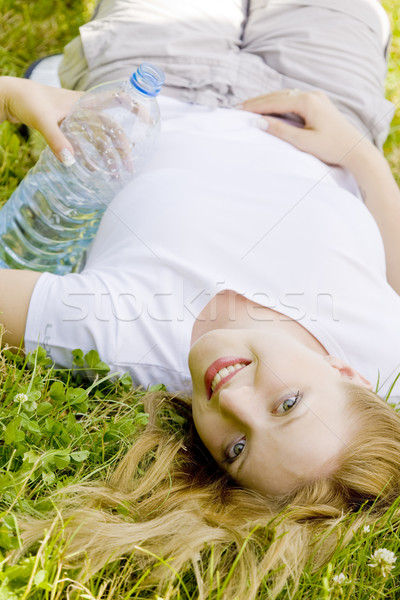 Сток-фото: женщину · бутылку · воды · трава · лет · пить