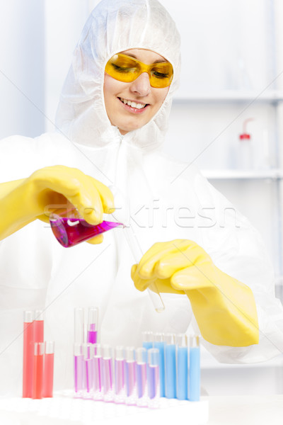 young woman wearing protective coat in laboratory Stock photo © phbcz
