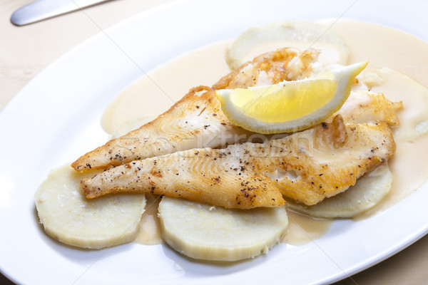 fried halibut with sweet potatoes and lemon sauce Stock photo © phbcz