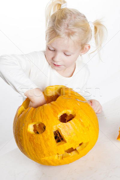 little girl carving pumpkin for Halloween Stock photo © phbcz