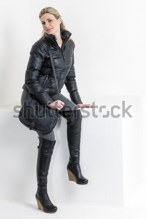 standing pregnant woman wearing fashionable black boots Stock photo © phbcz