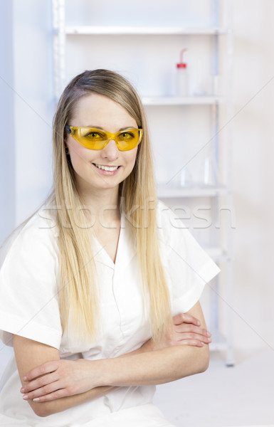 portrait of young woman with protective glasses in laboratory Stock photo © phbcz