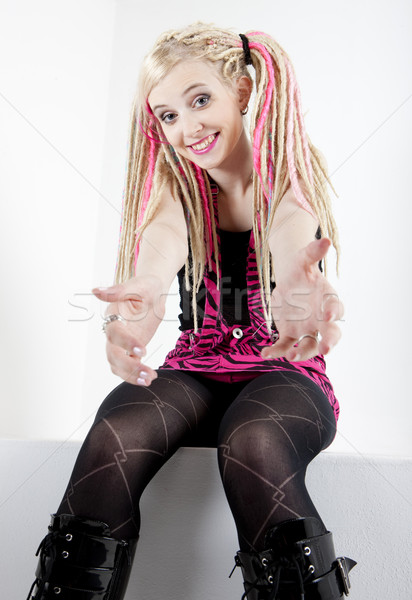 sitting young woman with dreadlocks Stock photo © phbcz