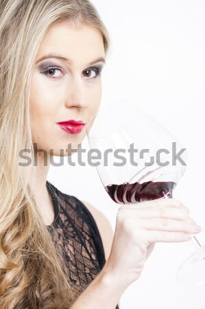 portrait of young woman with a glass of red wine and carafe Stock photo © phbcz