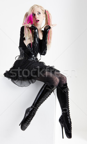 young woman with dreadlocks wearing extravagant clothes and boot Stock photo © phbcz