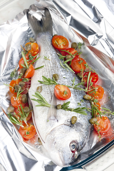 raw bream with herbs and cherry tomatoes Stock photo © phbcz