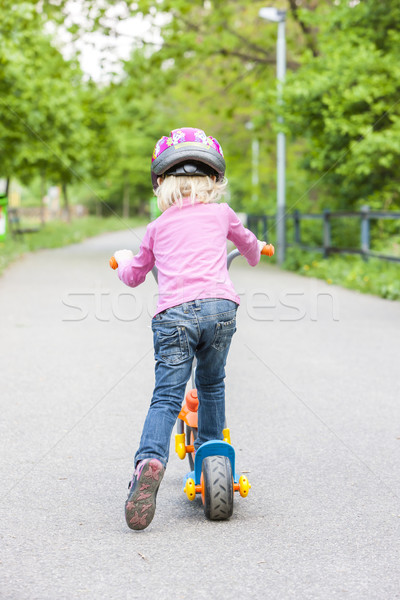 Kislány moped lány gyermek pihen póló Stock fotó © phbcz