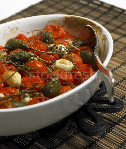 warm tomato salad with capers Stock photo © phbcz