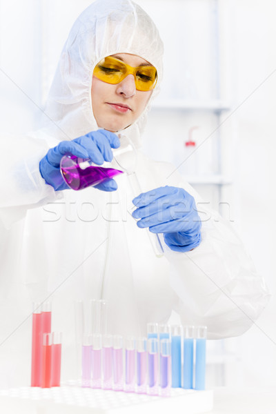 young woman wearing protective coat in laboratory Stock photo © phbcz