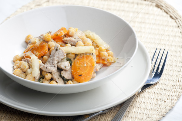 pork meat on celery with carrot and chick peas Stock photo © phbcz